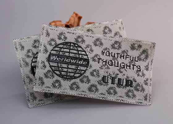 의류를 위한 검은 빛나는 로고들 맞춘 실리콘 브랜드로 출력됩니다